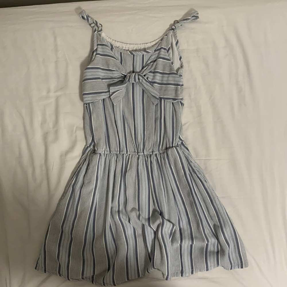 This is blue, light blue, grey, and white flowy and loose dress.